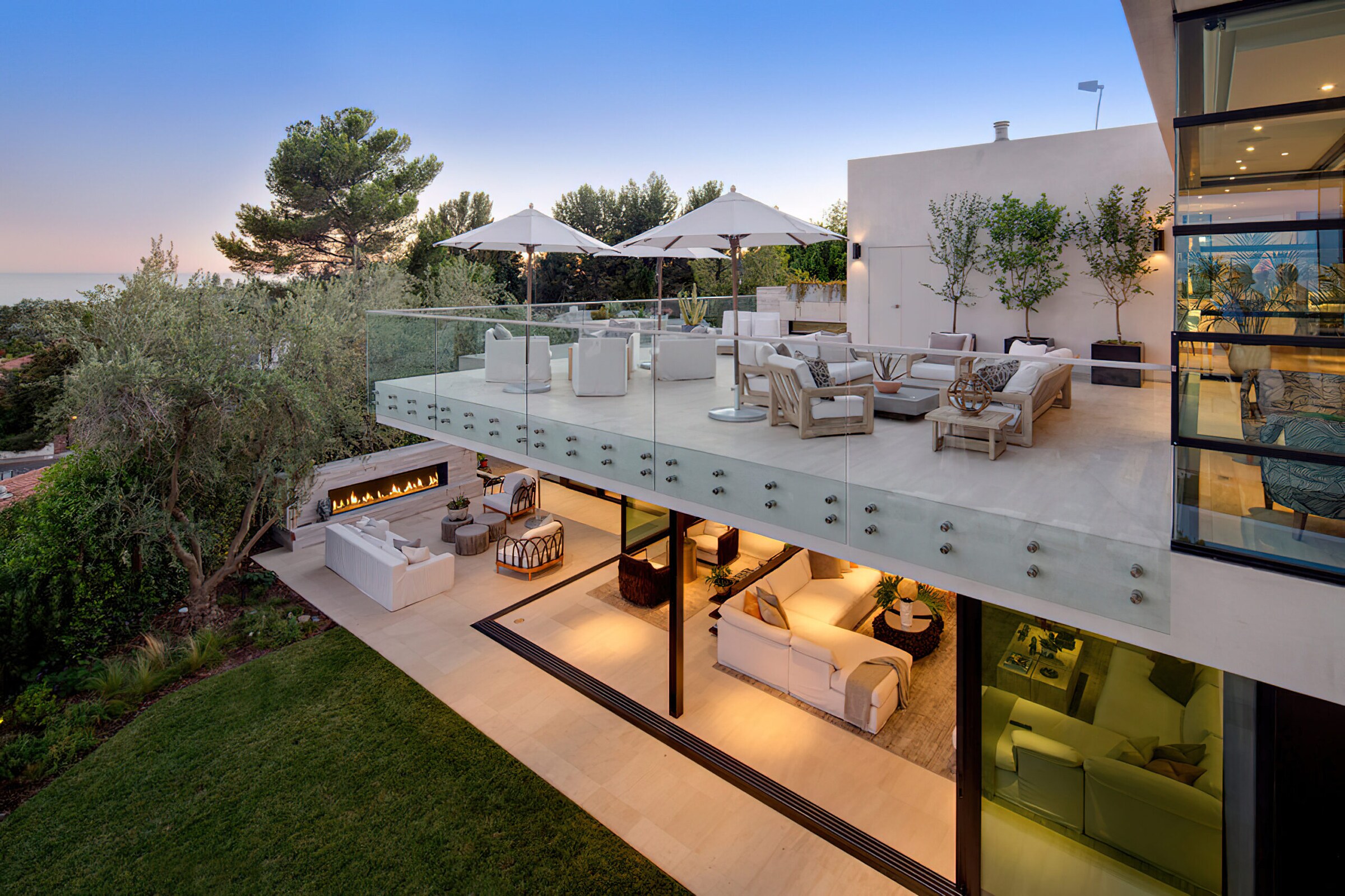 Luxury multi-panel sliding glass doors opening to a coastal Florida outdoor living space